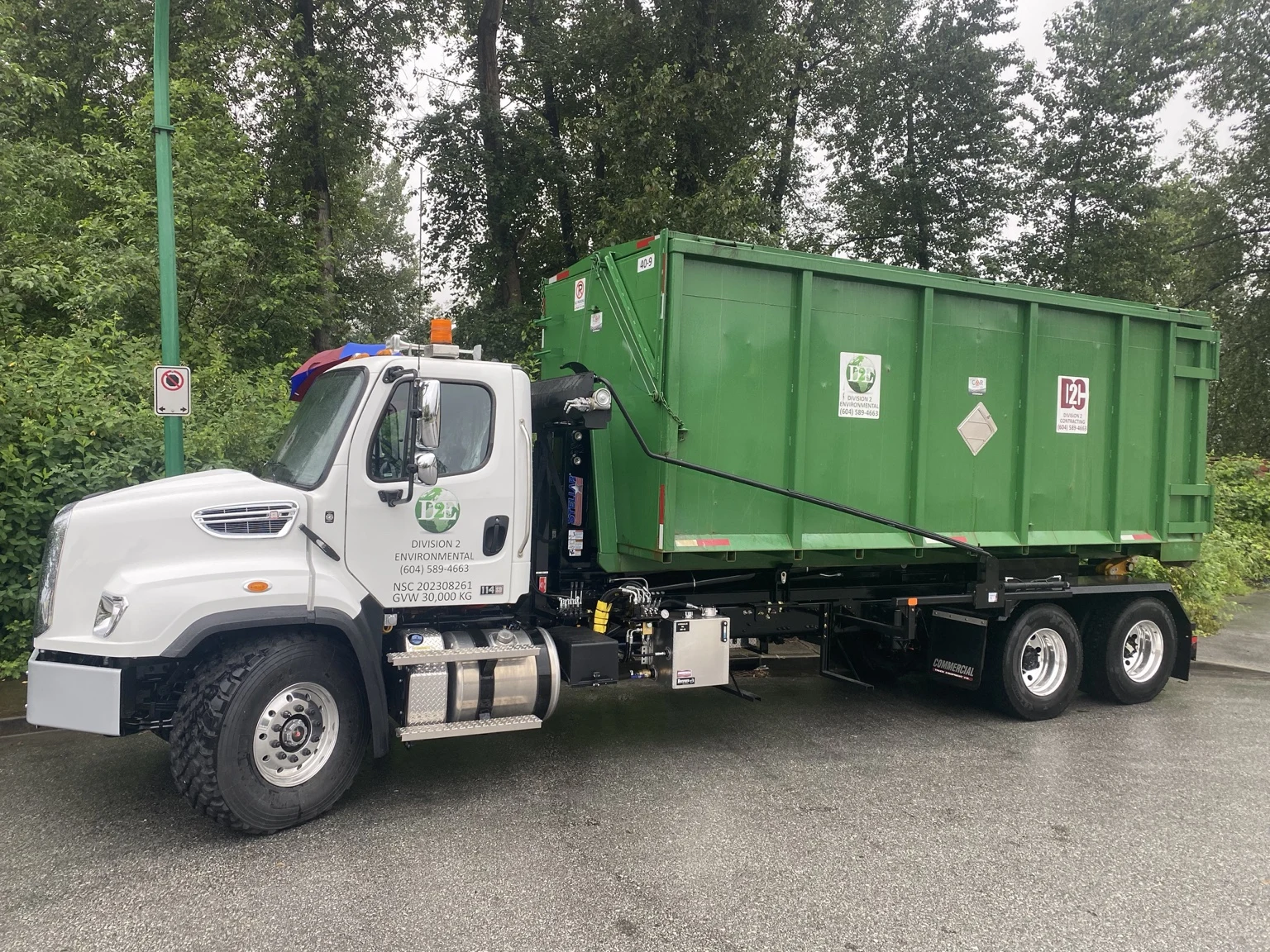 Division 2 tandem bin truck with a green bin
